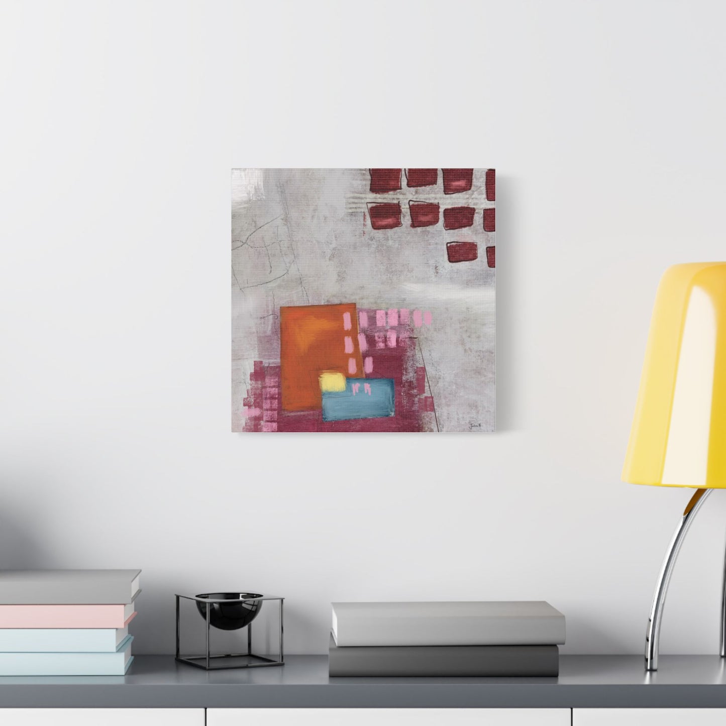 Living space featuring a stretched canvas wall art featuring an abstract design with muted hues.