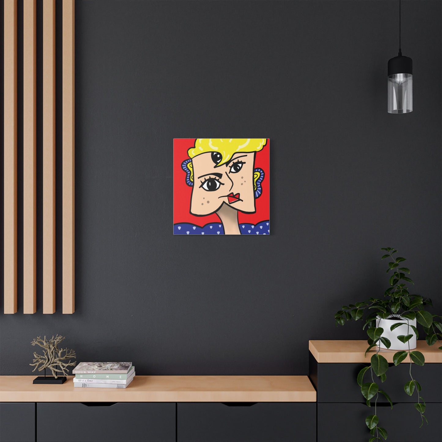 Interior living space showcasing a canvas wall art print featuring abstract face art with bold colours.