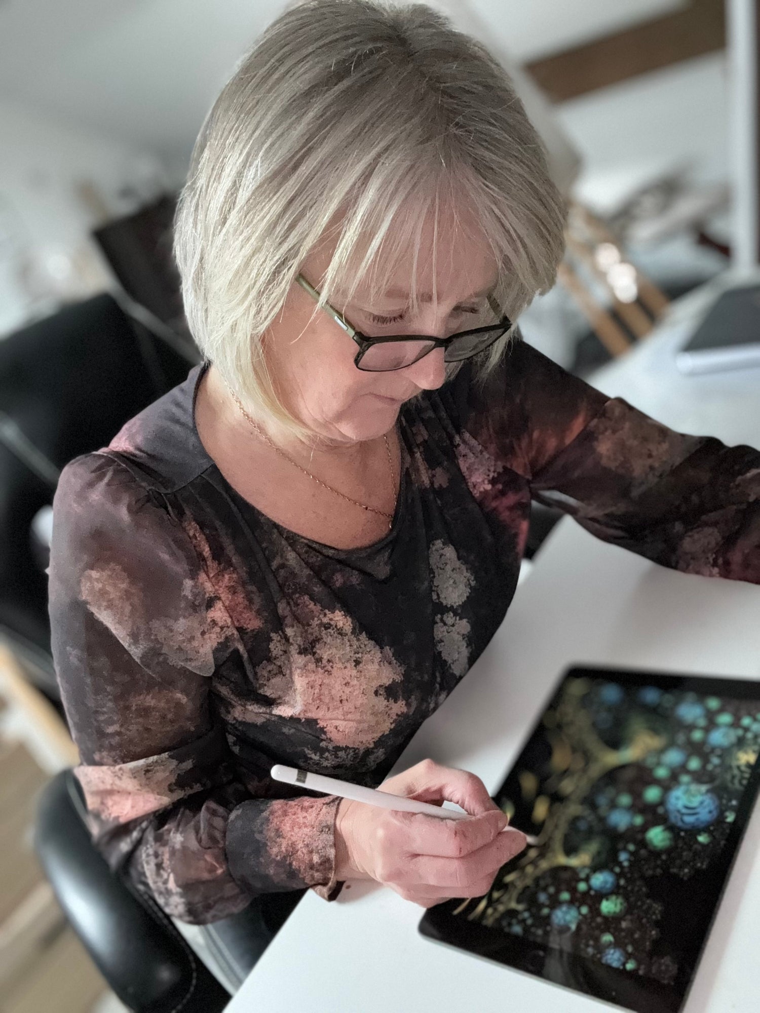 Artist Julia Hargreaves working on a piece of fractal art.