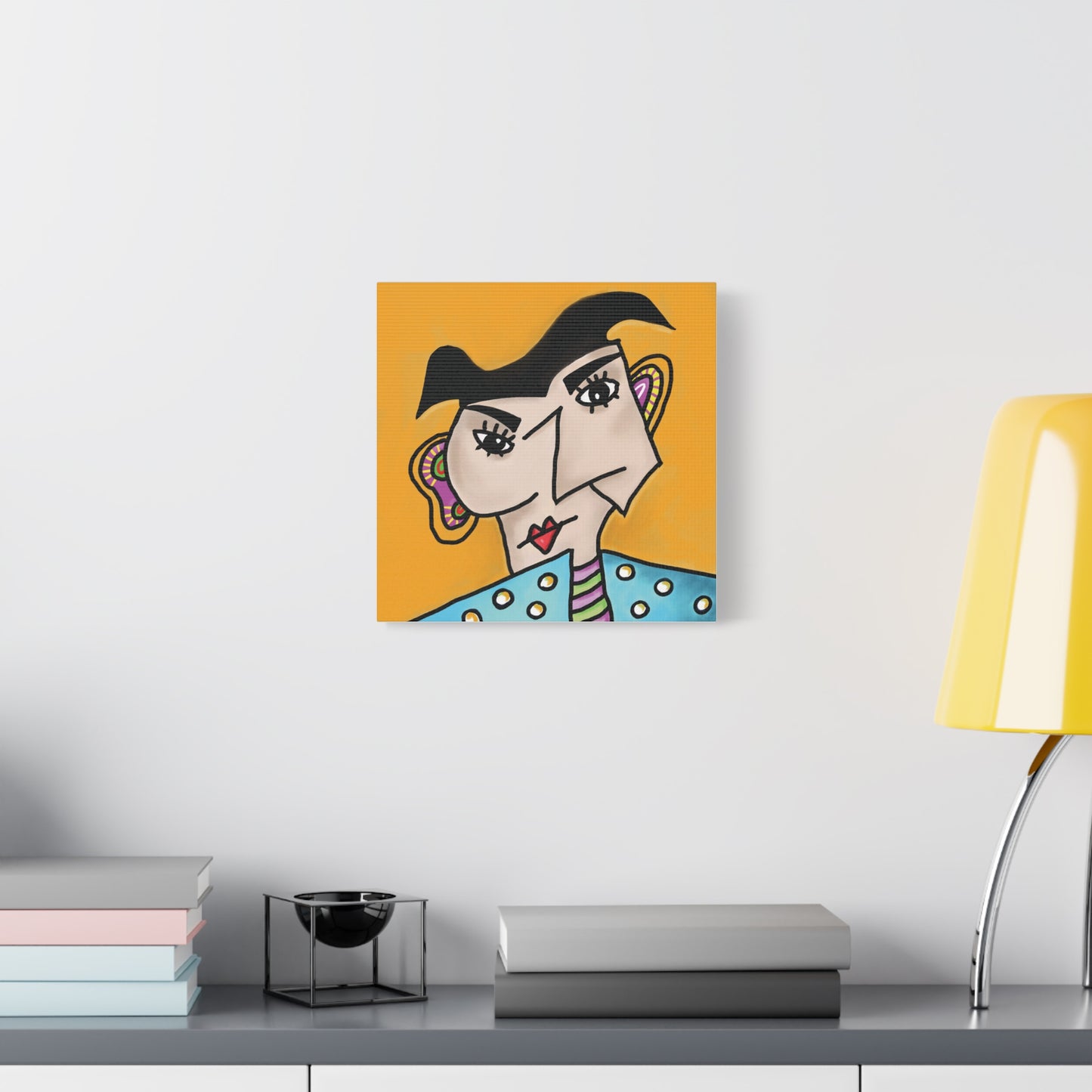 Abstract artwork of a face on an orange background in a modern interior setting.