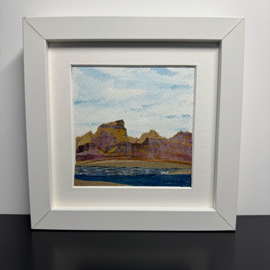 Landscape artwork in a white frame