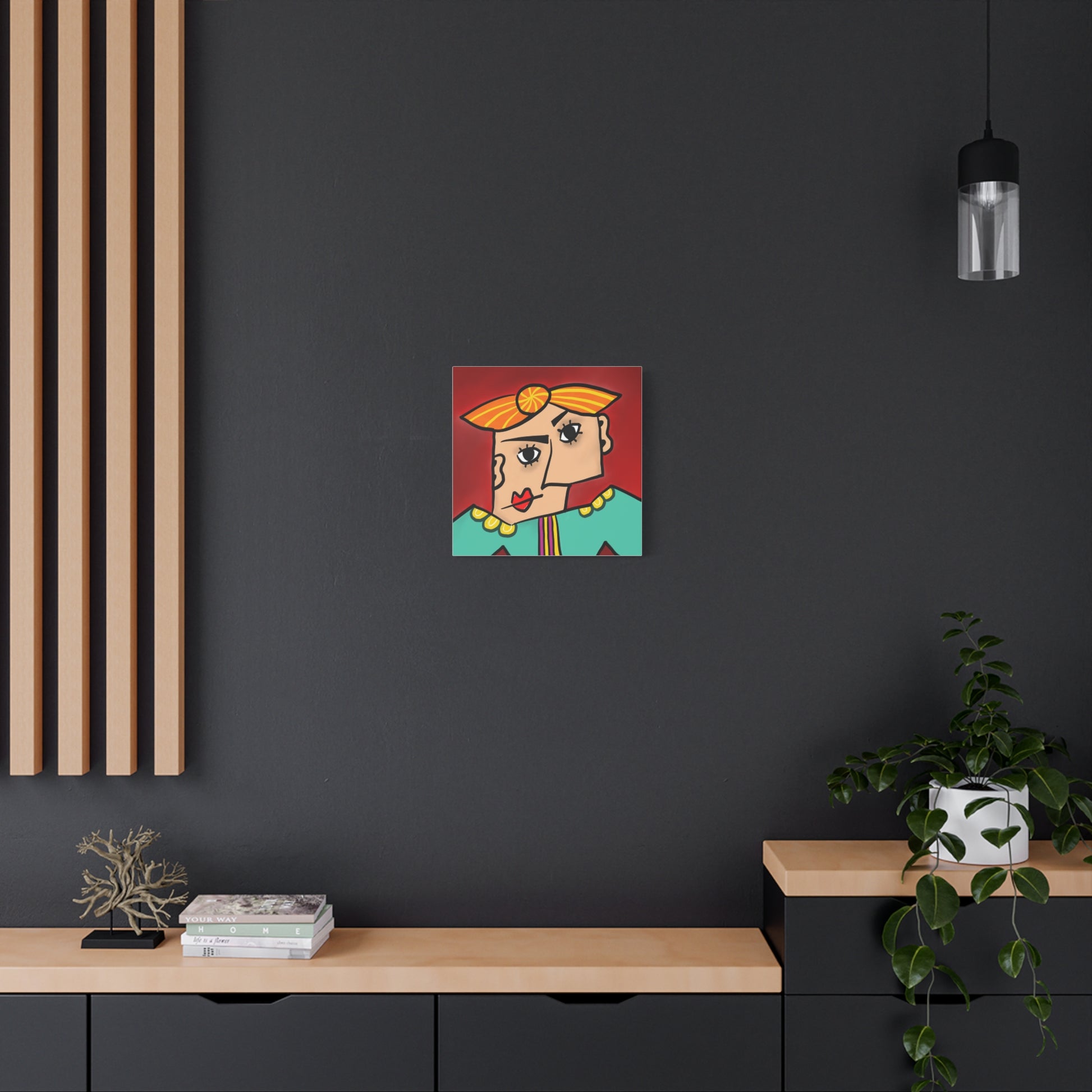 Abstract artwork on a dark wall with a wooden shelf and plant in the foreground